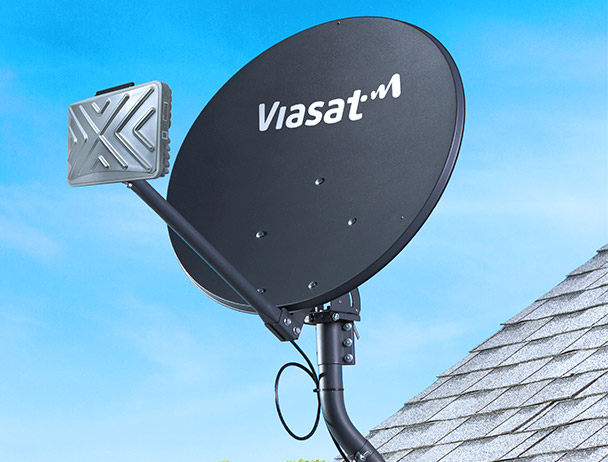 Viasat branded satellite dish with TRIA mounted to a rooftop