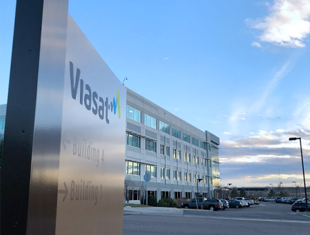 Angled view of the Viasat entrance sign in front of building 1 in Denver, CO