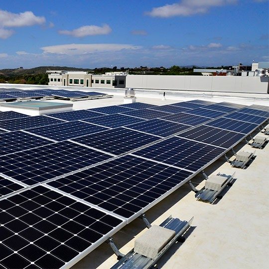 An array of solar panels on the roof at Viasat's Carlsbad, California campus