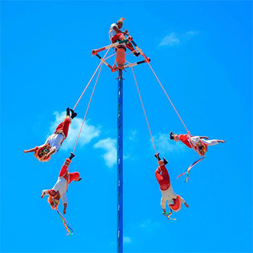 Guys hanging from a pole