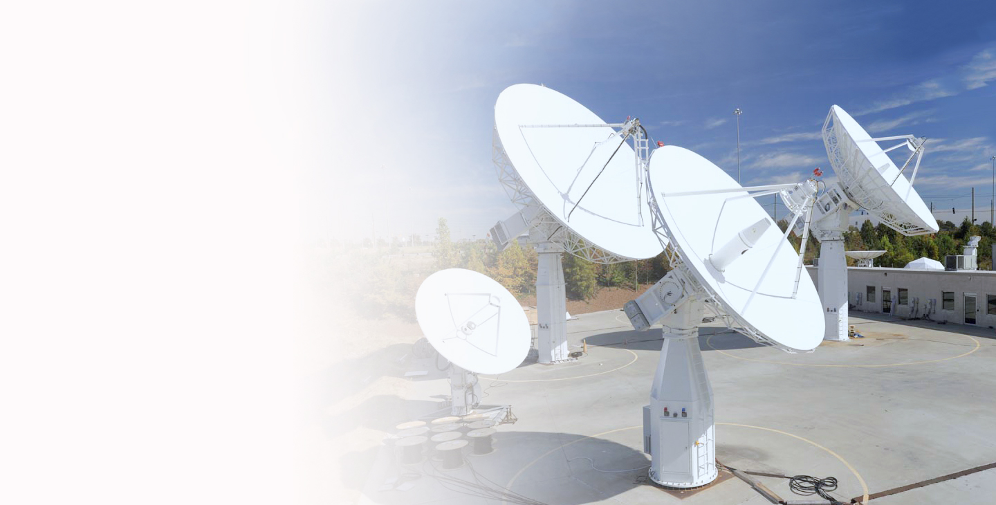 Four ground antennas pointed at the sky