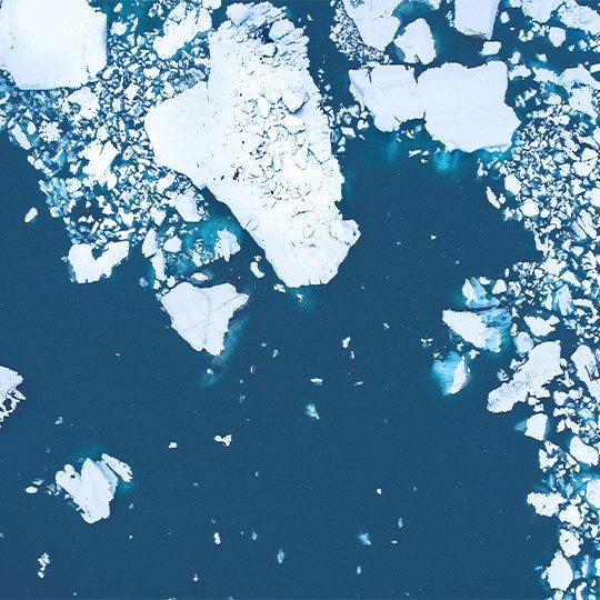 Aerial view of chunks of ice floating in the arctic