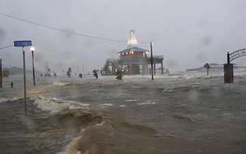 A picture of hurricane Ida striking a coastal community in Lousiana with damaging floods and high winds