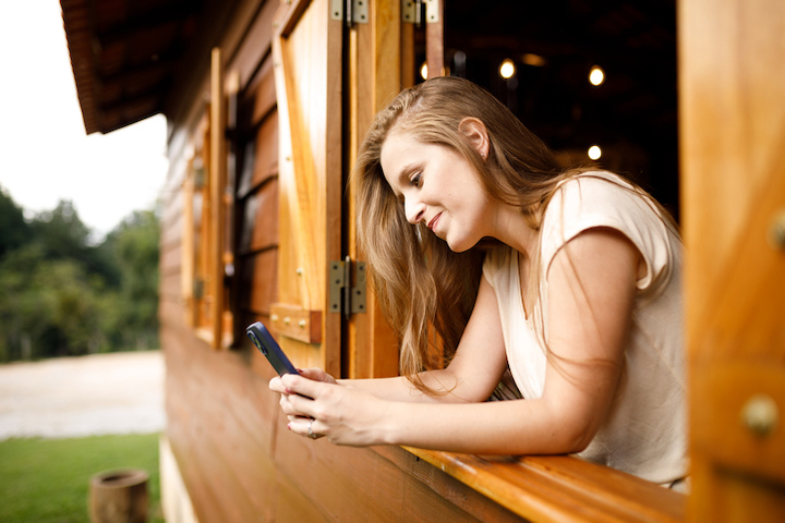 Woman with on phone in remote area