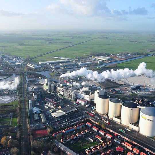 Factory located in a rural area with smoke coming out of the smoke stack, a great customer for Viasat enterprise internet