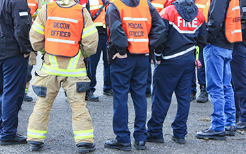 Viasat enterprise internet connects a disaster response team gathered around talking