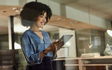 Female associate using satellite internet in store