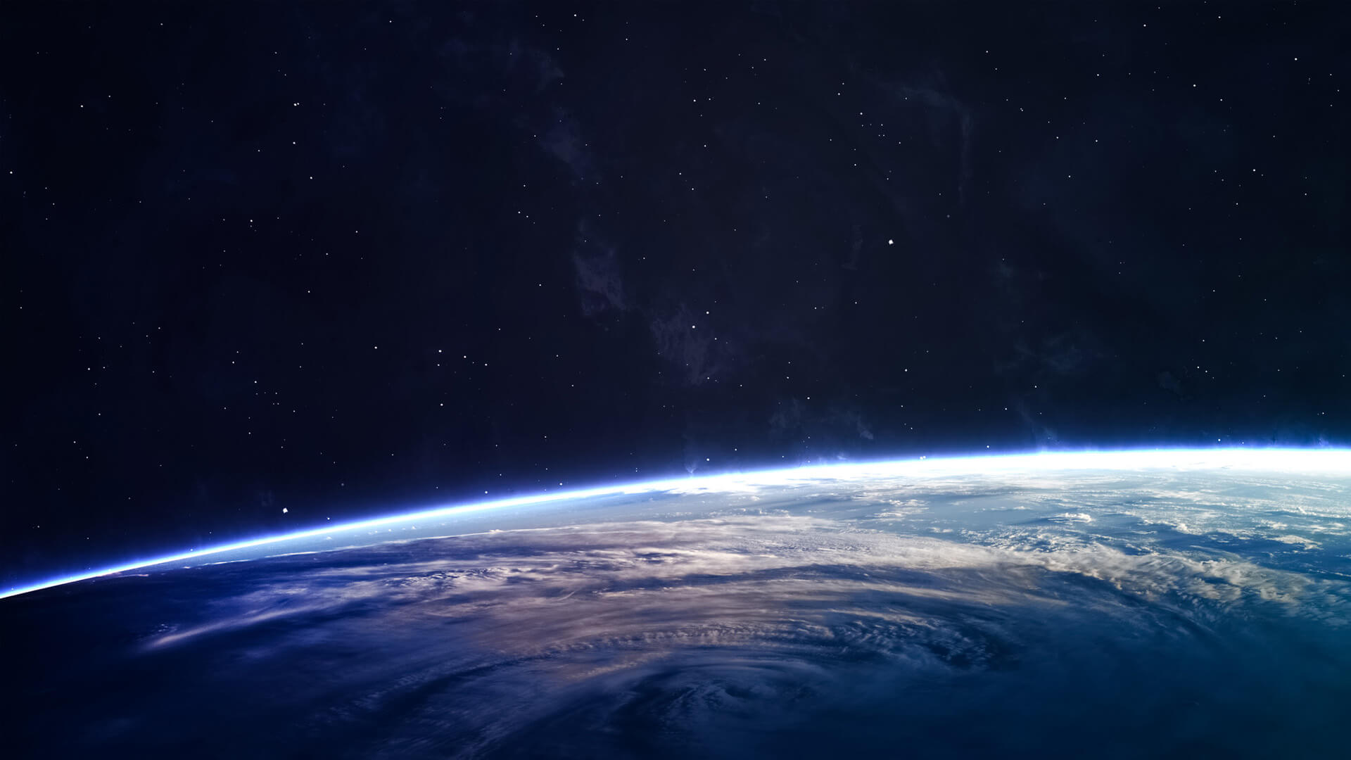 Portion of Earth atmosphere with stars above from space