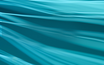 Aqua-colored background with a water-like design