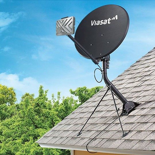 Viasat satellite dish mounted to roof of house