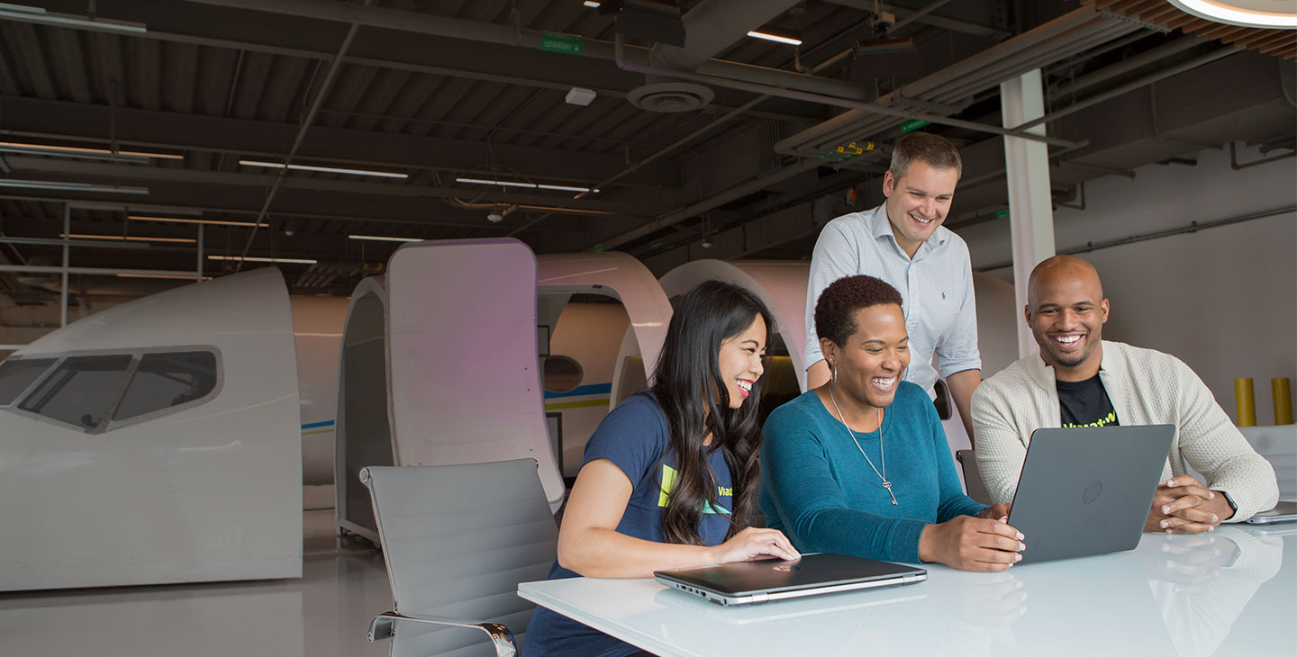 Viasat employees collaborating in our aviation space