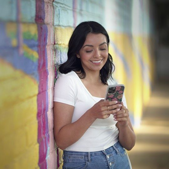 A woman connecting to the internet using ViaSat-3 service