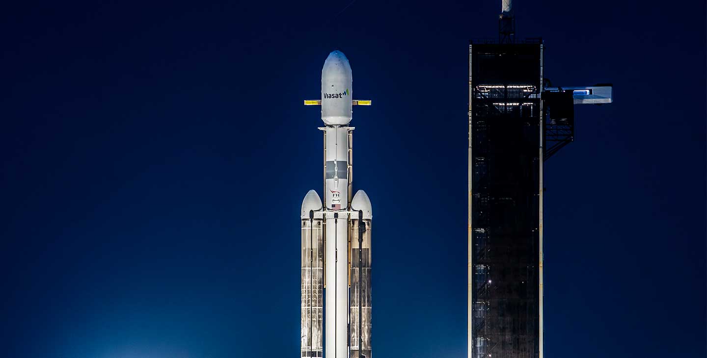 ViaSat-3 satellite on the launchpad at night