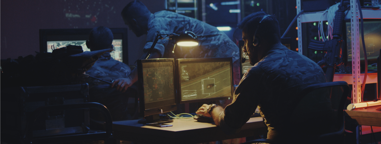inside military base control room using satellite on computers