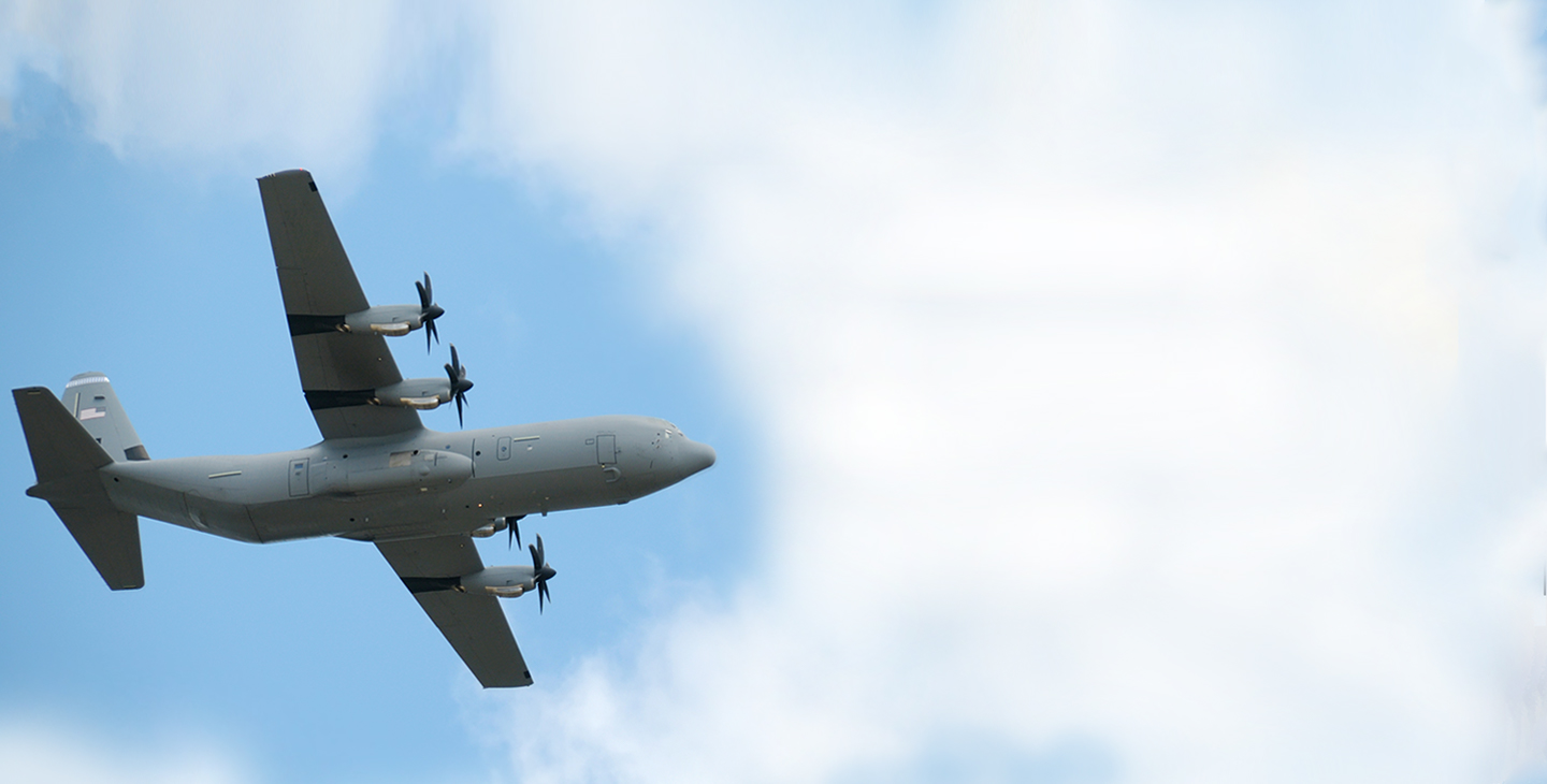 P-3 aircraft flying through the clouds