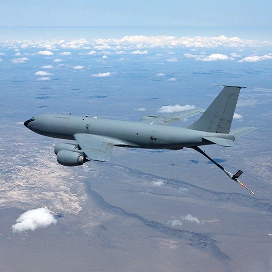 KC-146 aircraft flying and refuleing another platform utilizes dual-band antennas for airborne communications
