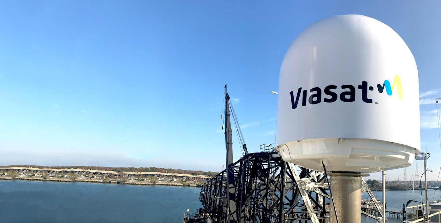Maritime terminal radome with a vibrant Viasat logo installed on a vessel