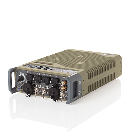 Tan colored Viasat CBM-400 commercial modem, ruggedized form factor, left angle