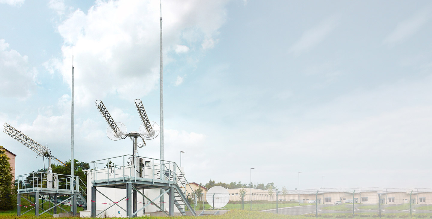 Two UHF SATCOM terminals mounted on top of metal platforms