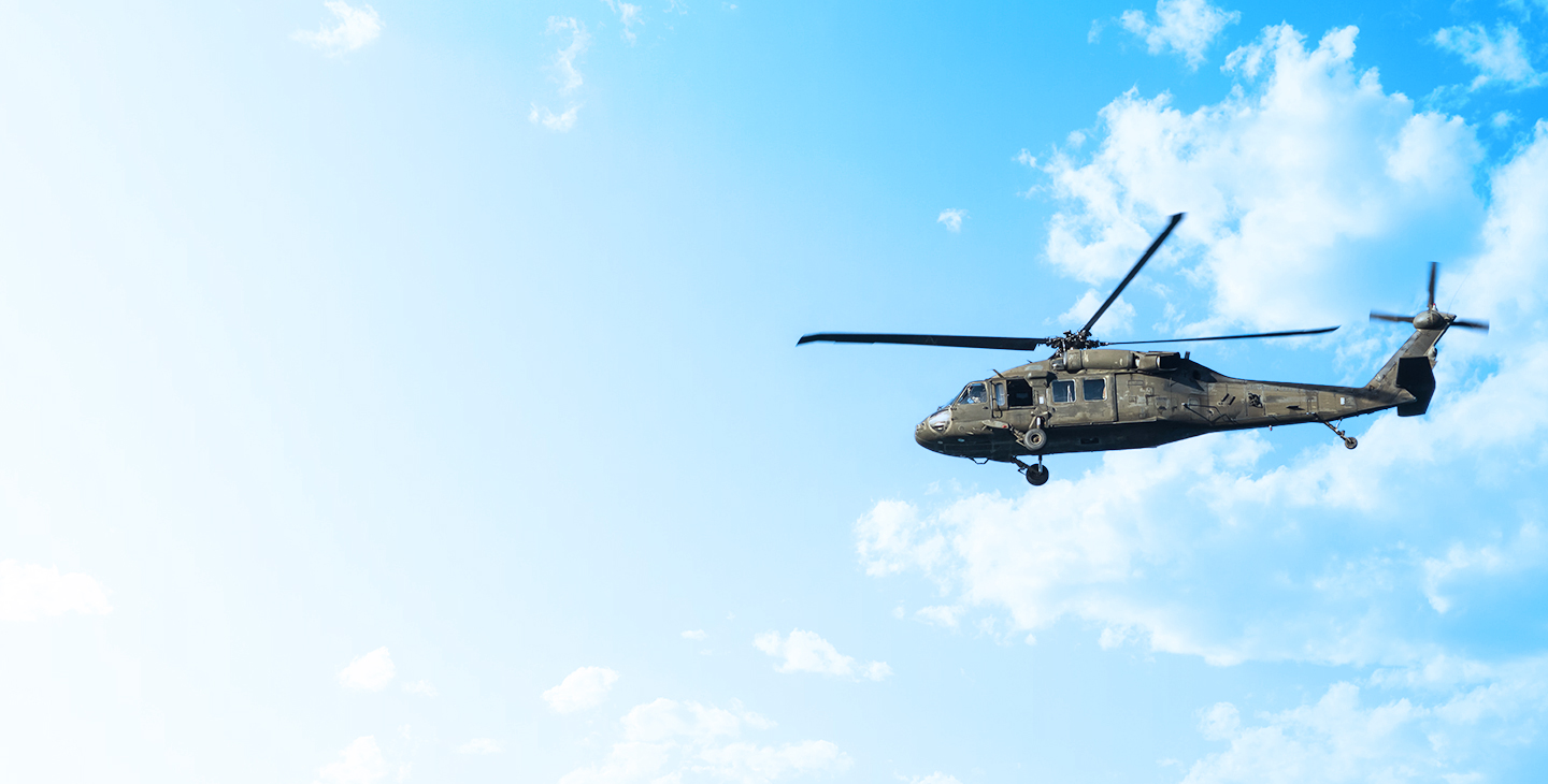 UH-60 helicopter flying through clouds