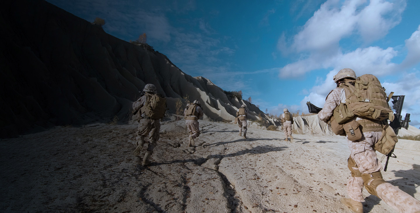 Ground operations team running through the sand