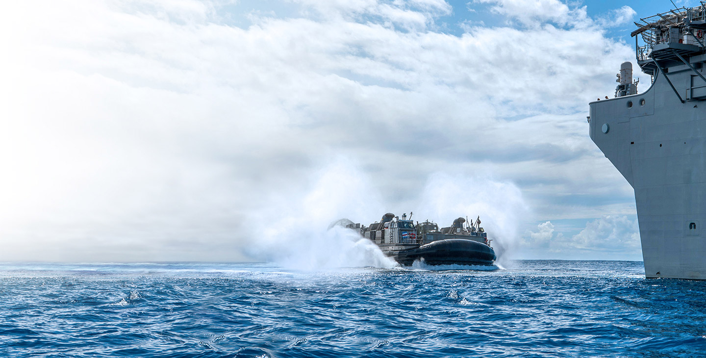 LCACS ship approaching a carrier out at sea