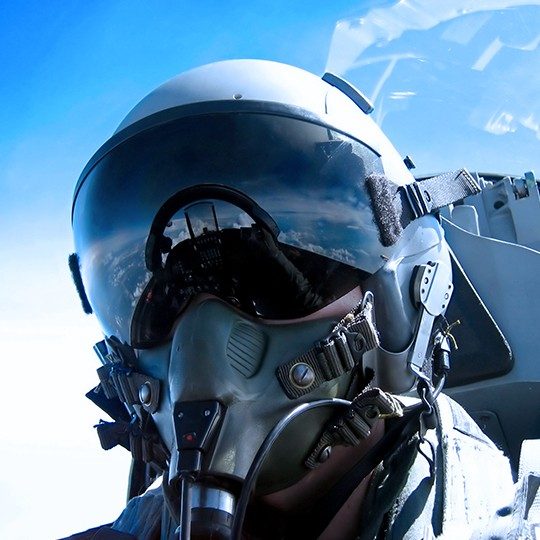 Fighter pilot utilizing airborne communication systems