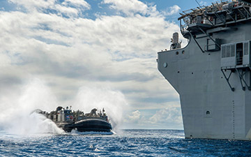 LCACS ship approaching a carrier out at sea