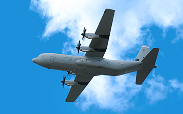 Defense aircraft flying through the clouds