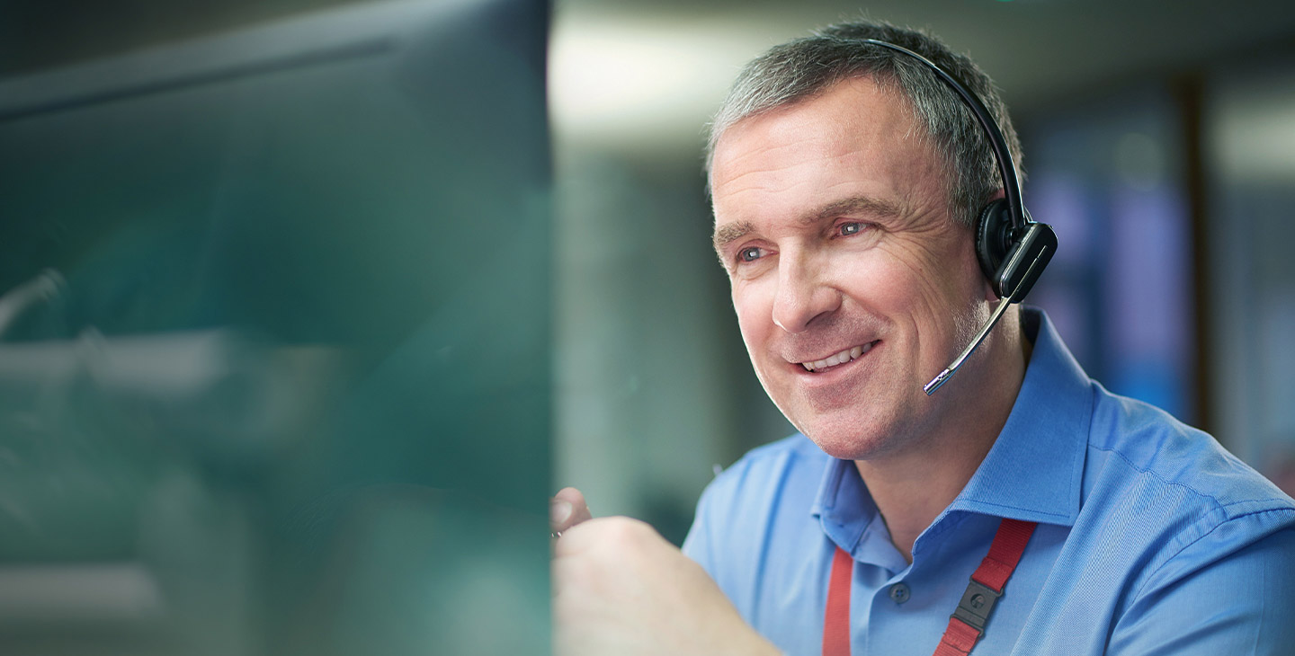 Viasat maritime internet service support rep talking to a customer on a headset