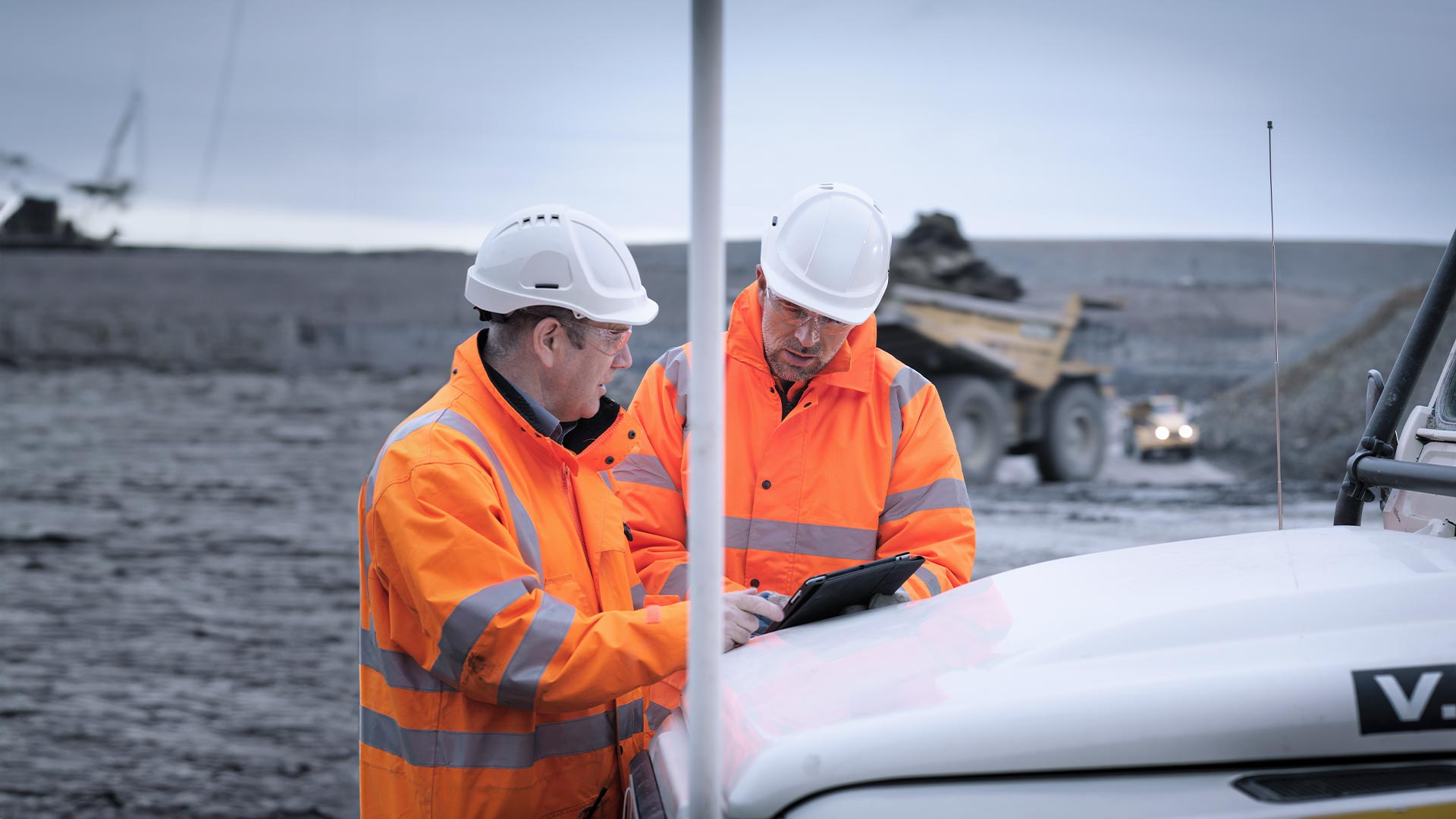 Men work on the job site while connected to satellite internet