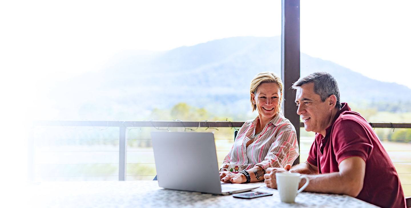 Couple enjoying fast internet on laptop