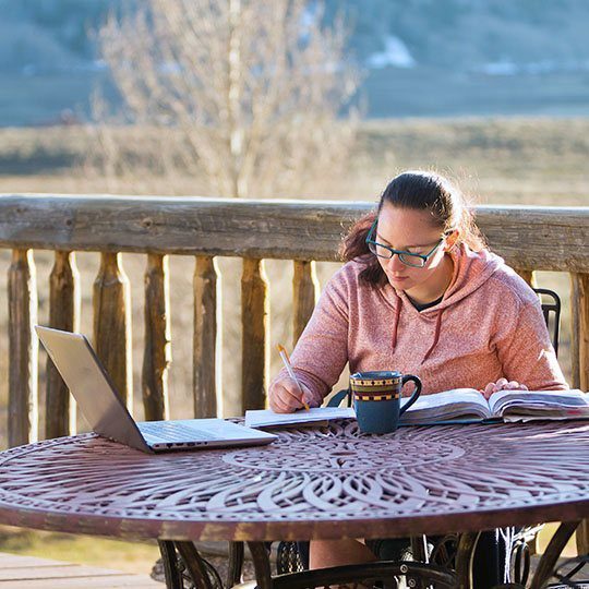 Woman using Viasat Internet to get work done