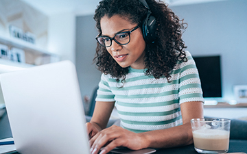 Woman utilizing high-speed internet on laptop