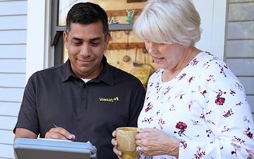 Technician explaining internet installation to customer