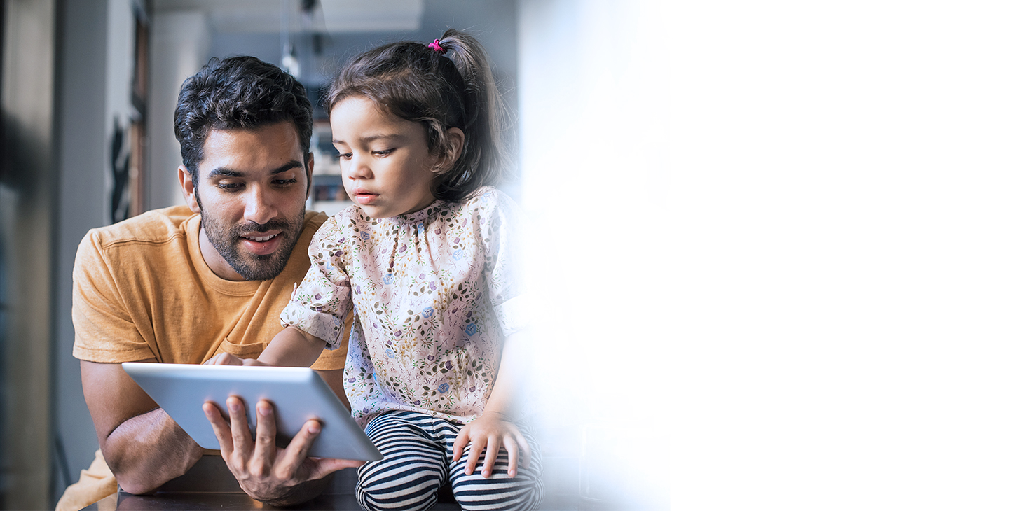 Man and child connected to Wi-Fi on tablet