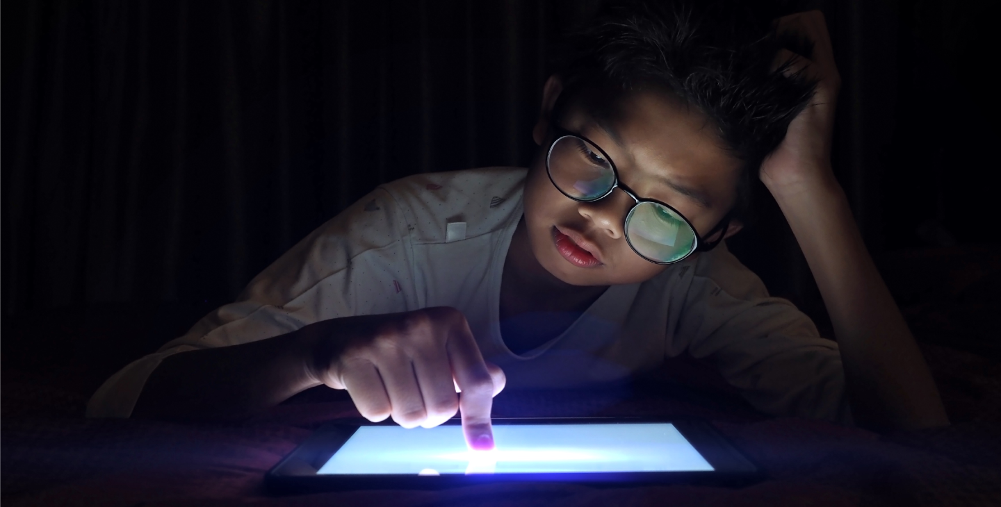 child using tablet device during power outage