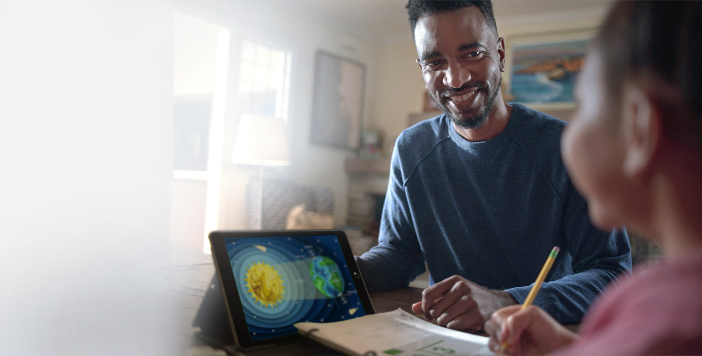 Father and child doing homework with tablet connected by Wi-Fi through Viasat's internet service