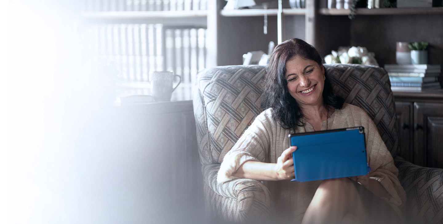 Woman connected to her tablet with Viasat Internet's built-in Wi-Fi
