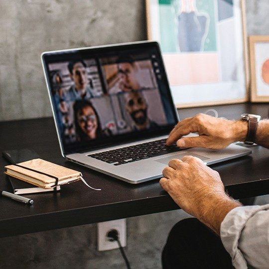 Man video conferencing using Office Hours data.