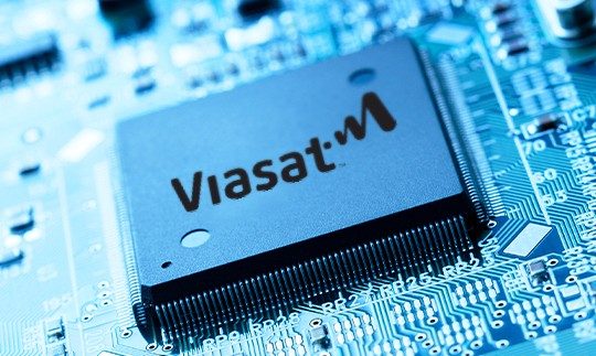 Close-up of the Viasat logo on an ASIC chip