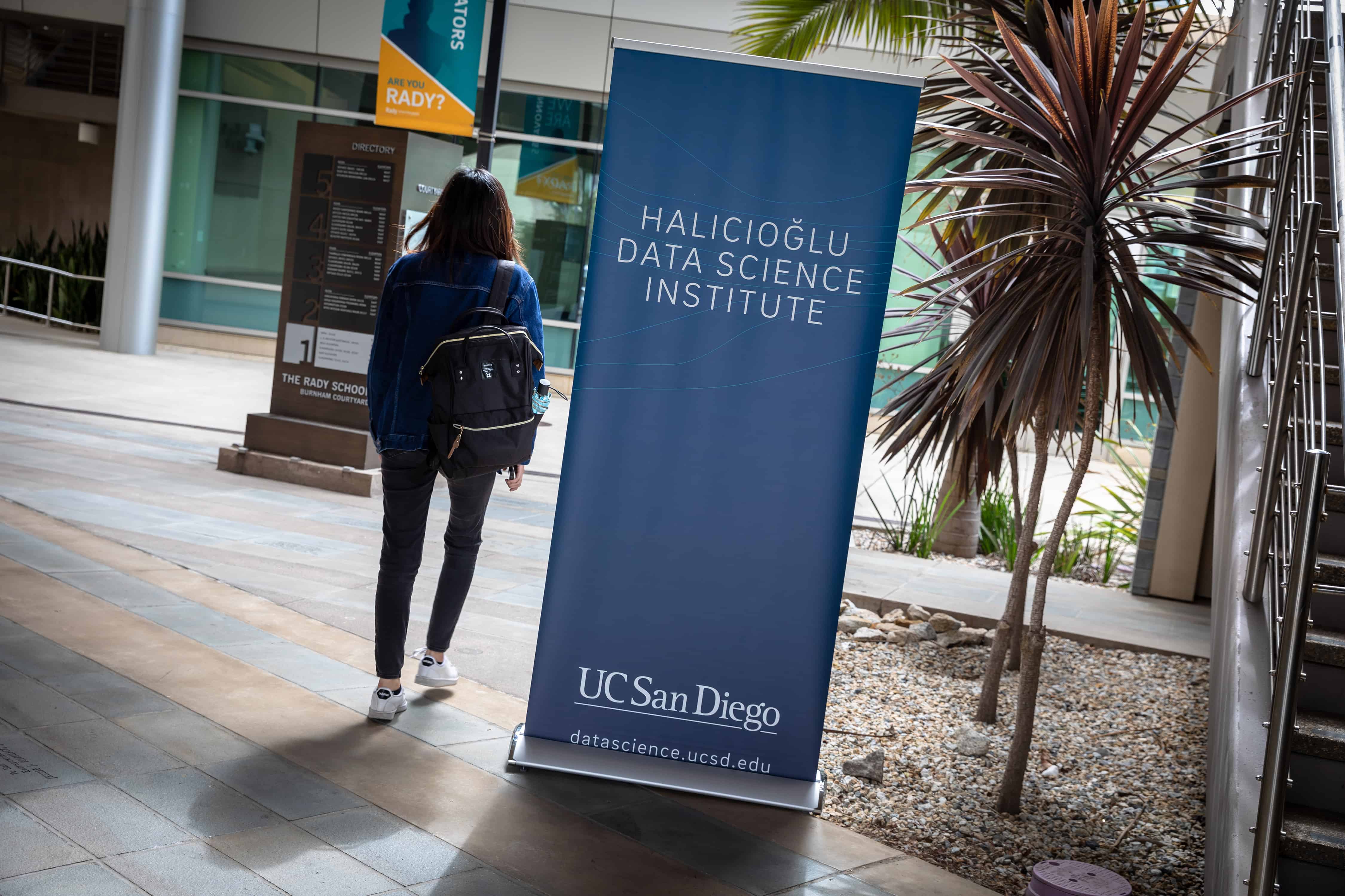 Student walking by UCSD& 4500w Photo of student by UCSD's HDSI